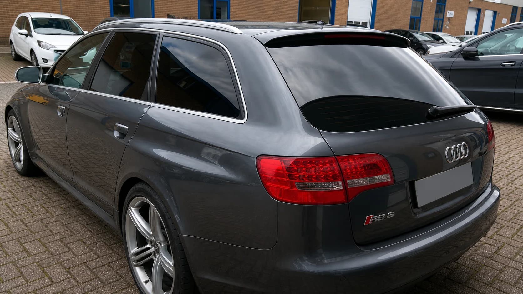 Estate car with dark tinted rear glazing